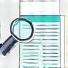 Needs assessment icon - magnifying glass over document
